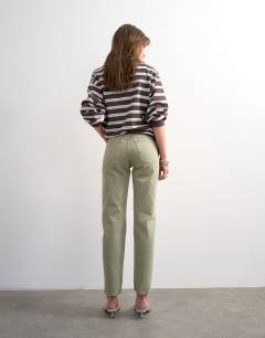 Model wearing Runway mid rise straight jean in washed khaki