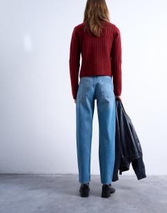 Model wearing Runway mid rise straight jeans in vintage blue