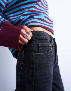 Model wearing Runway mid rise straight jeans in washed black