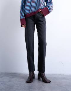 Model wearing Runway mid rise straight jeans in washed black