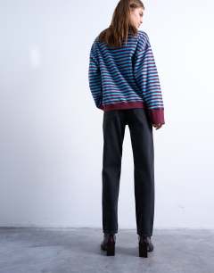 Model wearing Runway mid rise straight jeans in washed black