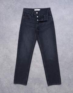 Model wearing Runway mid rise straight jeans in washed black