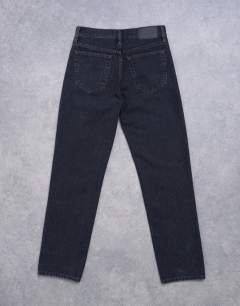 Model wearing Runway mid rise straight jeans in washed black