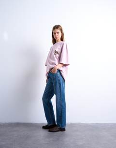 Model wearing Runway straight mid rise jean in mid blue