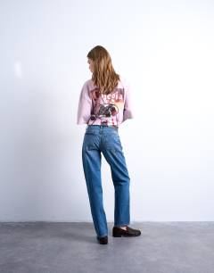 Model wearing Runway straight mid rise jean in mid blue