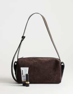 Model wearing Sabrina medium suedette shoulder bag with pockets in chocolate