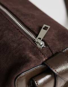 Model wearing Sabrina medium suedette shoulder bag with pockets in chocolate