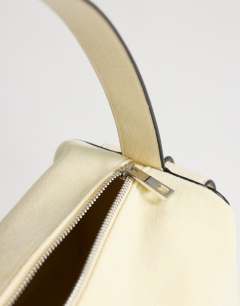 Model wearing Sabrina medium suedette shoulder bag with pockets in cream