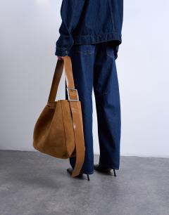 Model wearing Sade premium real suede leather bucket shoulder bag in tan