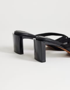 Model wearing Sadie toe thong heel in black