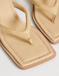 Model wearing Sadie toe thong heel in camel