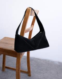 Model wearing Safia real suede shoulder bag in black