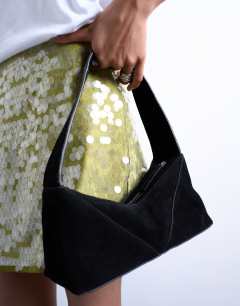 Model wearing Safia real suede shoulder bag in black
