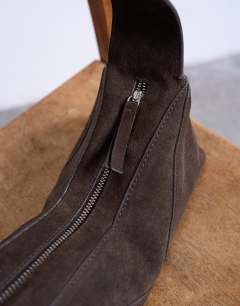 Model wearing Safia real suede shoulder bag in chocolate