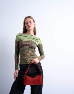 Model wearing Safia real suede shoulder bag in rust