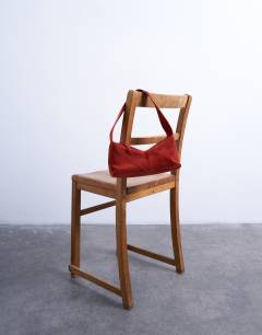 Model wearing Safia real suede shoulder bag in rust
