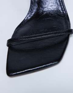 Model wearing Sally 2 part metal heeled sandal in black