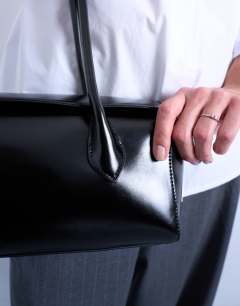 Model wearing Sally folded bag in black