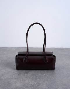Model wearing Sally folded bag in burgundy
