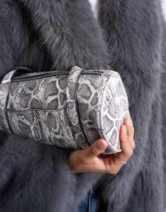 Model wearing Salma bowler bag in snake