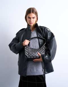 Model wearing Samantha studded shoulder bag in black