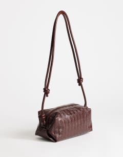 Model wearing Samara small weave cross body bag in tan