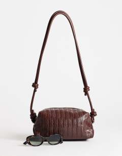 Model wearing Samara small weave cross body bag in tan