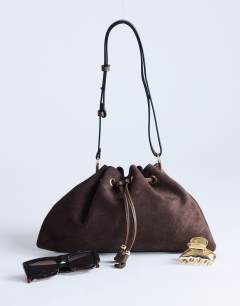 Model wearing Sammy ruched drawstring shoulder bag in tan