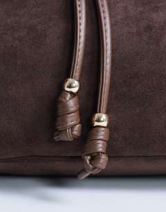 Model wearing Sammy ruched drawstring shoulder bag in tan