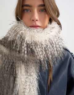 Model wearing Sandy wispy faux fur scarf in off white and grey