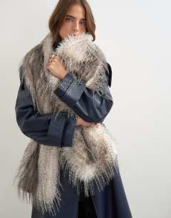Model wearing Sandy wispy faux fur scarf in off white and grey