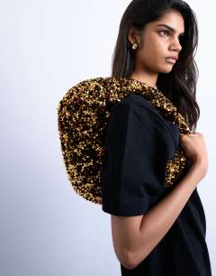 Model wearing Santana scoop sequin shoulder bag in gold