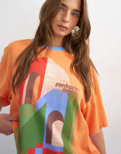 Model wearing Topshop 'Santorini Nights' graphic oversized tee in orange