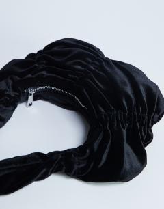 Model wearing Saphire ruched velvet shoulder bag in black