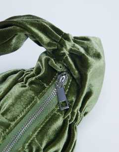 Model wearing Sapphire ruched velvet shoulder bag in khaki