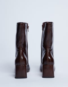 Model wearing Sara Premium leather square toe flared heel boot in chocolate 