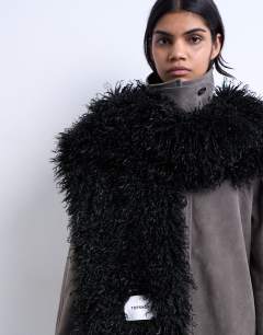 Model wearing Sara shaggy faux fur blanket scarf in black