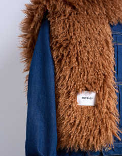 Model wearing Sara shaggy faux fur blanket scarf in tan