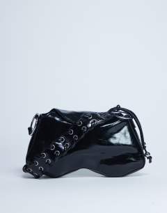 Model wearing Sarah whipstitch shoulder bag in black