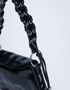 Model wearing Sarah whipstitch shoulder bag in black