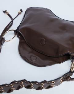 Model wearing Sarah whipstitch shoulder bag in chocolate