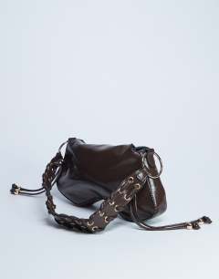 Model wearing Sarah whipstitch shoulder bag in chocolate