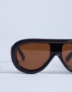 Model wearing Sardinia aviator sunglasses in brown