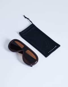 Model wearing Sardinia aviator sunglasses in brown