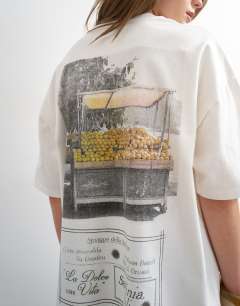Model wearing Sardinia lemon graphic oversized tee in ecru