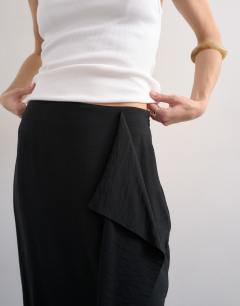 Model wearing Sarong wrap midi skirt in black