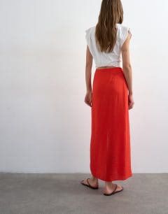 Model wearing Sarong wrap midi skirt in red