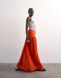 Model wearing Sash tie crinkle full maxi skirt in orange