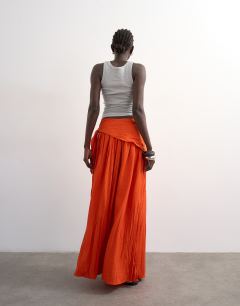 Model wearing Sash tie crinkle full maxi skirt in orange