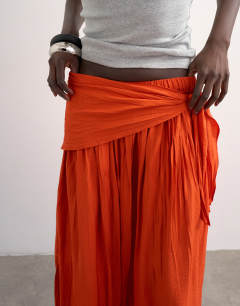 Model wearing Sash tie crinkle full maxi skirt in orange